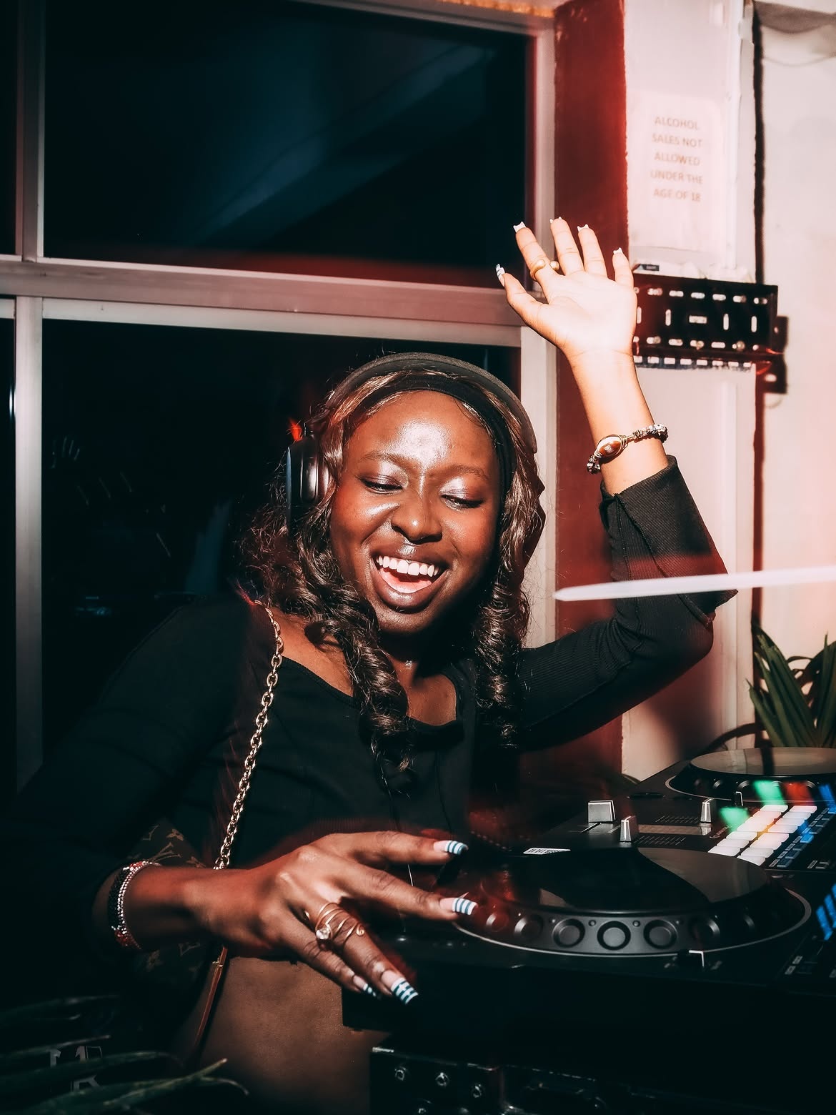 A Room Steward DJing at a Wild House night